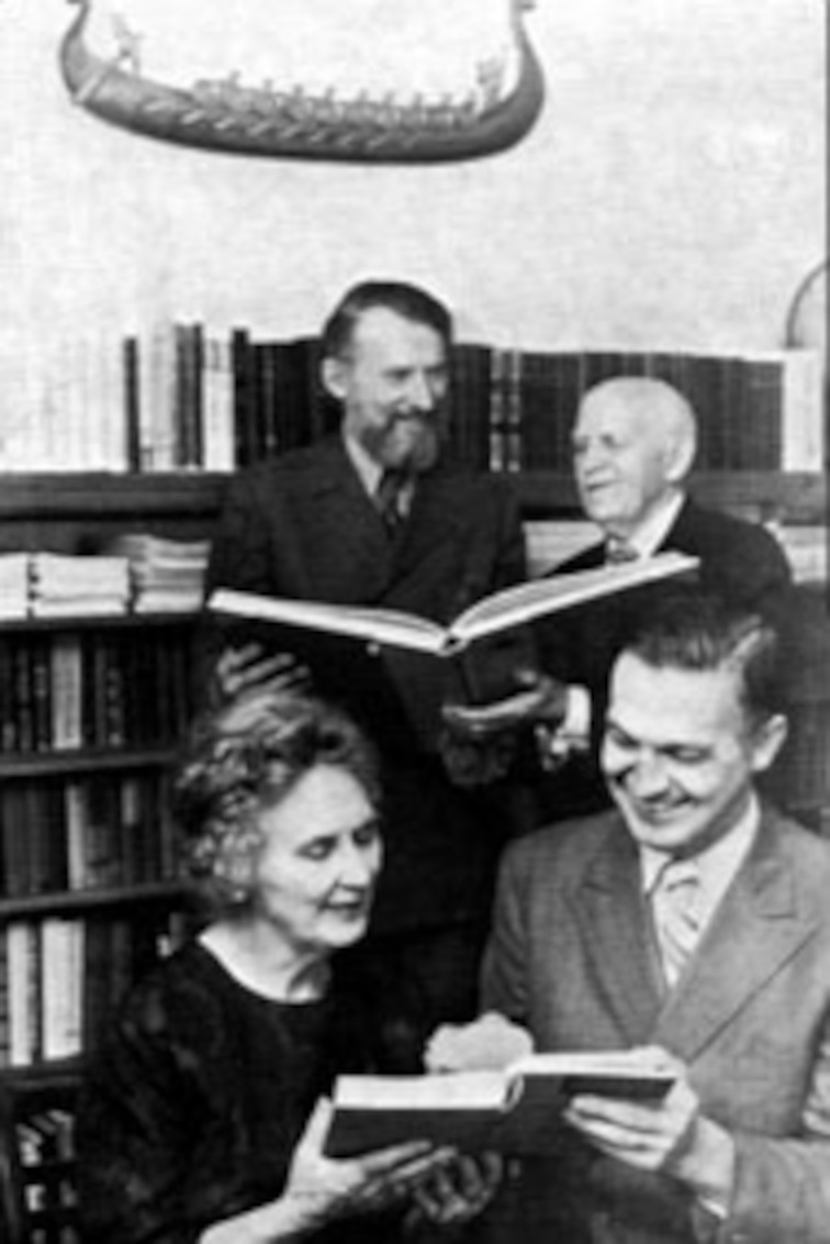 With Mrs. Beck is UVic President Bruce Partridge and Dr. Beck is with UVic Librarian Dean Halliwell accepting the first book.